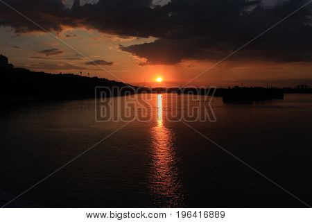 Sunset of the fiery sun over the Dnieper