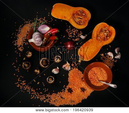 Сomposition of vegetables and cereals on a black background
