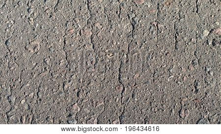 The texture of asphalt with small stones.