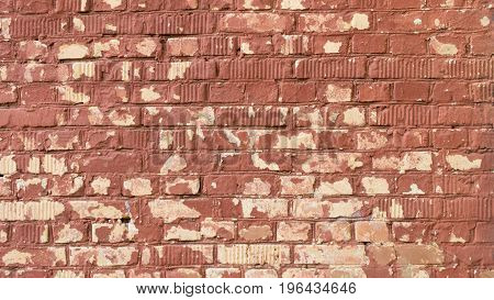 the texture of brick wall with flaking paint