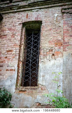 Window of the ruined temple of St. Nicholas in the village of Gribny. Russia, Tver region.