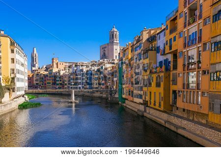 Colorful Red, Orange And Yellow Houses And Bridge Through River Onyar In Girona, Catalonia, Spain. S