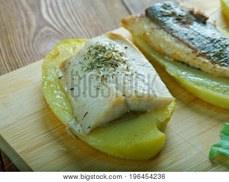 Patata con anguila al horno - Eel with baked potatoes.Spanish cuisine