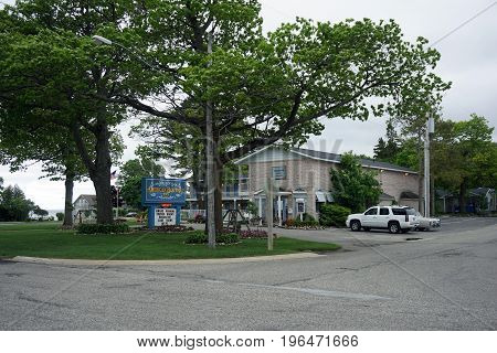 MACKINAW CITY, MICHIGAN / UNITED STATES - JUNE 18, 2017: The American Boutique Inn offers award winning themed rooms, breakfast, lake views and wifi to lodgers in Mackinaw City.