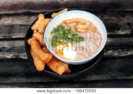 Pork's Rice Porridge Served With Deep-fried Dough Stick.