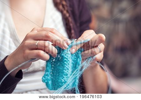 Close Up Young Woman Knits