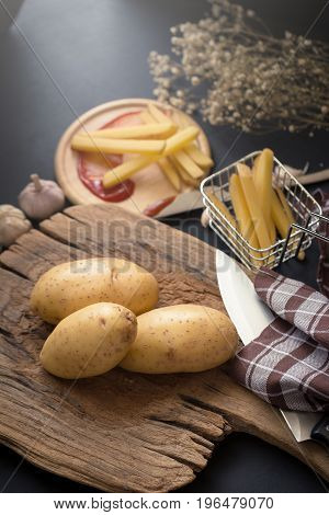 Deep Fried Potato Slice And Potato On Wooden Baord For Cooking