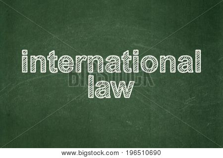 Politics concept: text International Law on Green chalkboard background