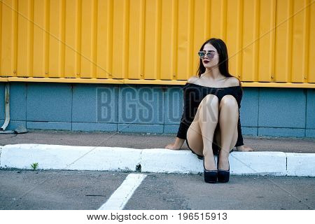 Gorgeous Brunette Girl With A Beautiful Make-up In Fashionable Clothes: A Black Blouse And Shorts Wi