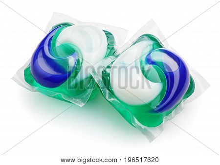 Two washing gel capsule pods with laundry detergent isolated on white background with clipping path