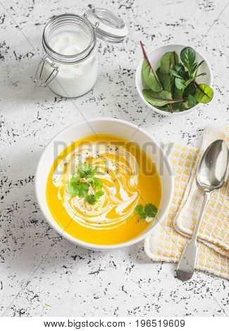 Caramelized golden beet and fall roots soup on a light background top view. Vegetarian food concept
