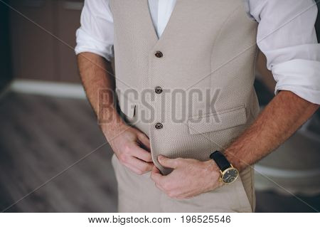 Elegant Groom In Wedding Jacket Wearing White Shirt And Turquoise Tie. Groom's Hands On Blue Suit.