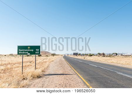 A distance sign on the B1-road at Grunau a village in the Karas Region of Namibia