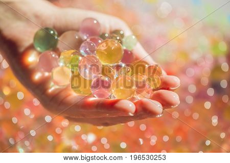 Colored Balls Of Water Beads, Hydrogel In In Hands. Sensory Experiences