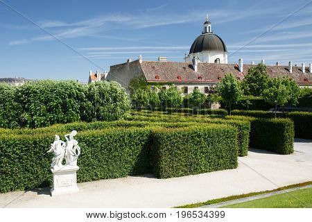 Fragment Beautiful Garden Of The Lower Belvedere Palace And View Of The Dome Of The Church. Vienna