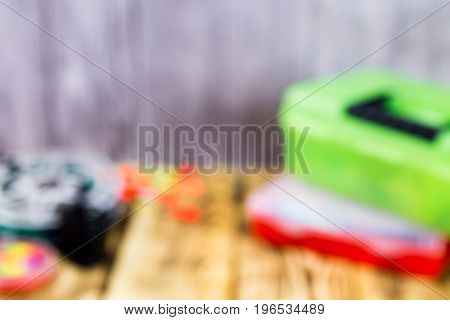 fishing acsessories blurred background on the wooden table