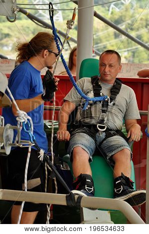 Russia Sochi Skypark - August 16 2014: A man prepares to bungee jump jump from a height of 69 metres from a special platform which is located at the bridge Skybridge
