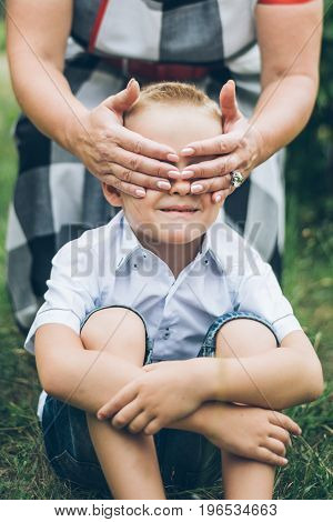 kids playing in the park, guess who, closing each other eye, siter and brother