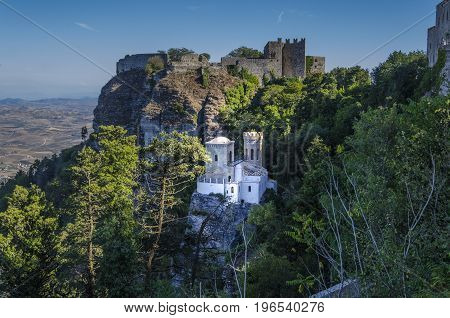 Above the old castle as close-up the tower pepoli and in the distance the plains of the island of Sicily from the ancient city of Erice