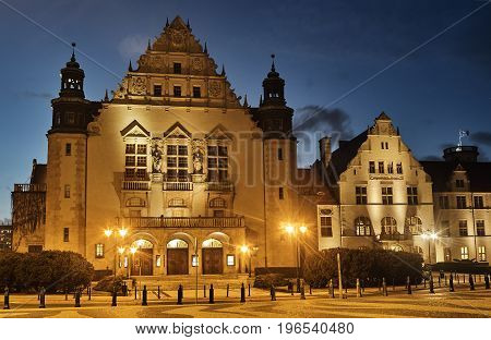 Neorenaissance facade of the building of the university auditorium at night in Poznan