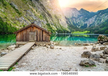Beautiful landscape with wooden boathouse on the mountain lake in Bavarian Alps Obersee Berchtesgaden Germany Europe