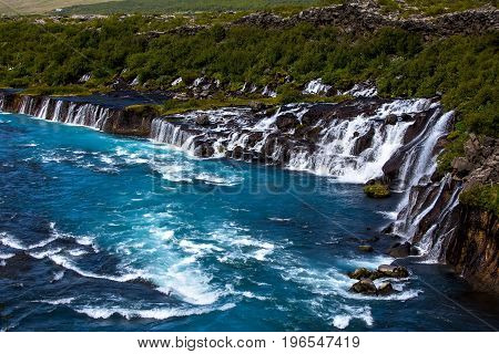 Hraunfossar series of waterfalls formed by rivulets streaming over a distance of about 900 metres