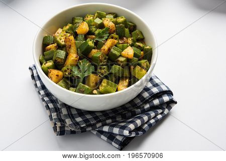 Indian masala fried bhindi or bhendi or Okra or ladyfinger curry or sabji, selective focus
