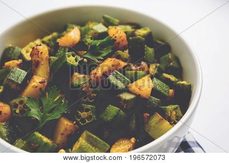 Indian masala fried bhindi or bhendi or Okra or ladyfinger curry or sabji, selective focus