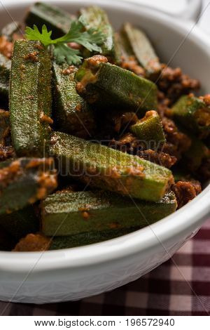Indian masala fried bhindi or bhendi or Okra or ladyfinger curry or sabji, selective focus