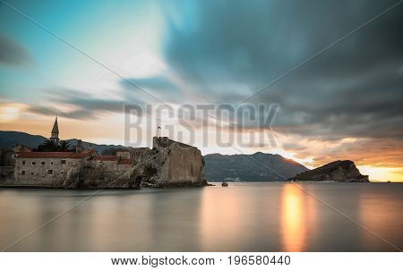 Clouds over the sea and the old city at sunrise