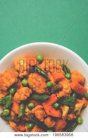 indian spicy food Gobi matar Masala or cauliflower curry with green peas or phool gobi fry, selective focus