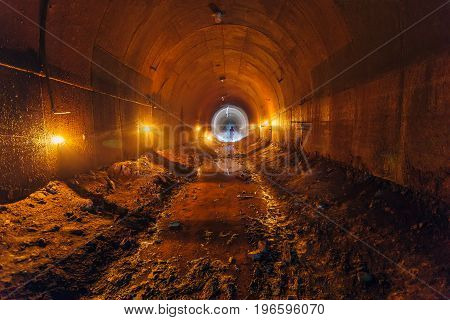 Abandoned old rusty dirty metal mining tunnel