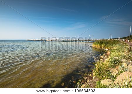 Wooden pier in Jurata town on coast of Baltic Sea Hel peninsula Poland