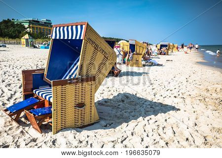 Wicker chairs on Jurata beach on sunny summer day Hel peninsula Baltic Sea Poland