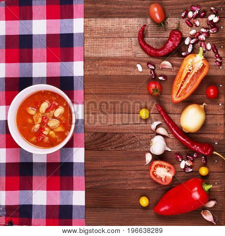 Tom Yum Goong Spicy Sour Soup on wooden table top view Thai local food