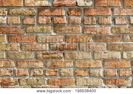 Bright pronounced texture of the old brick on the wall