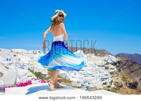 Woman dancing on the roofs. Vintage look.