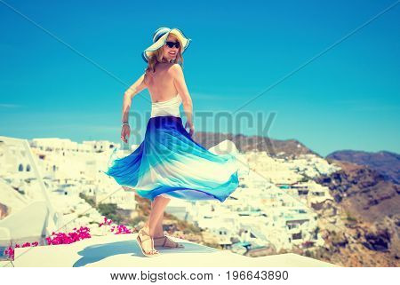 Woman dancing on the roofs. Vintage look.
