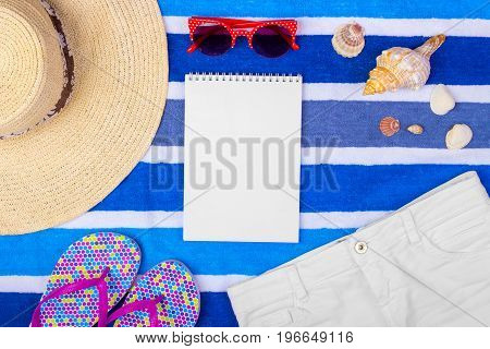 Travel accessories and fashion on blue copy space for travel poster.