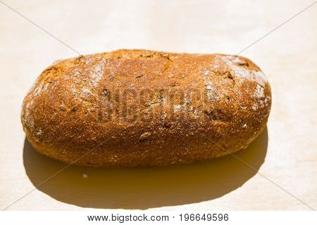 Whole grain bread alone on table, tasty, wheat