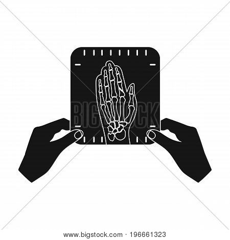 X-ray picture of the hand of a person in the hands of a radiologist. Medicine single icon in black style vector symbol stock illustration .