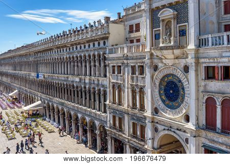Venice, Italy - May 21, 2017: Piazza San Marco or St Mark's Square with ancient Clock tower (Torre dell'Orologio). This is the main square of Venice.