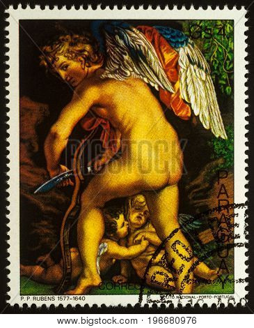 Moscow Russia - July 23 2017: A stamp printed in Paraguay shows painting Amur Cutting the Bow by Rubens series 