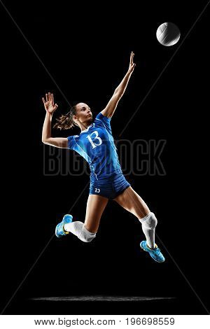 Female professional volleyball player isolated on black background