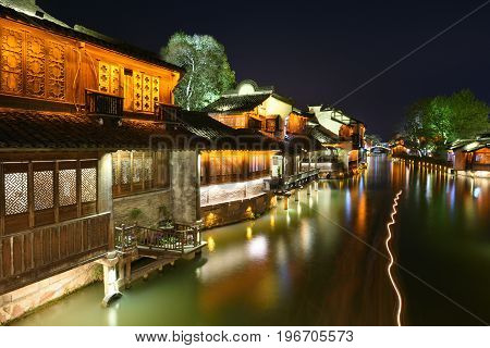 WUZHEN CHINA - MARCH 24: Night scene of Wuzhen on March 24 2016 in Wuzhen China. Wuzhen is a historic scenic town located in northern Zhejiang Province China