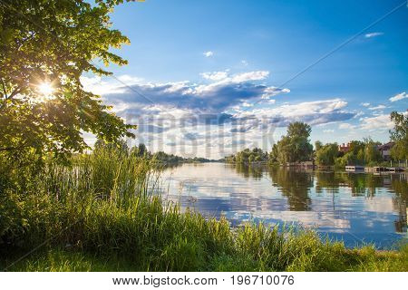 Summer sunset lake river reflection sky clouds in the water Relax lounge happy