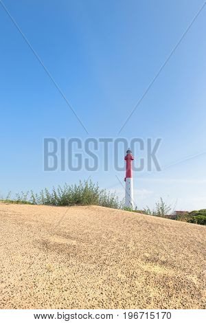 Lighthouse red and white at the French west beach
