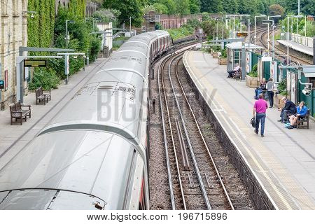 West Brompton Underground Station Platforms, With Southbound Train Leaving From Platform