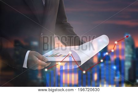 Close-up Of Businessman analyzing Graph.man thinking plan of business