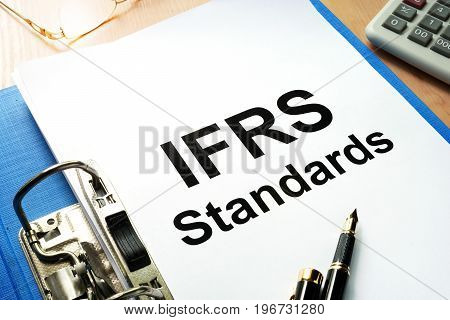 A Folder with documents IFRS standards. Business concept.
